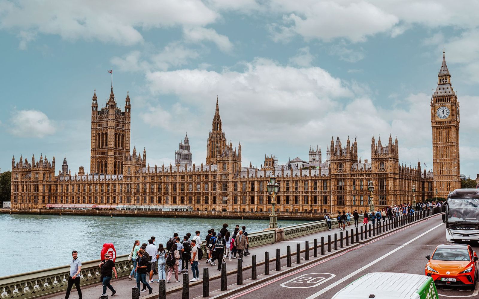 Visitors walking across Westminster Bridge towards Big Ben